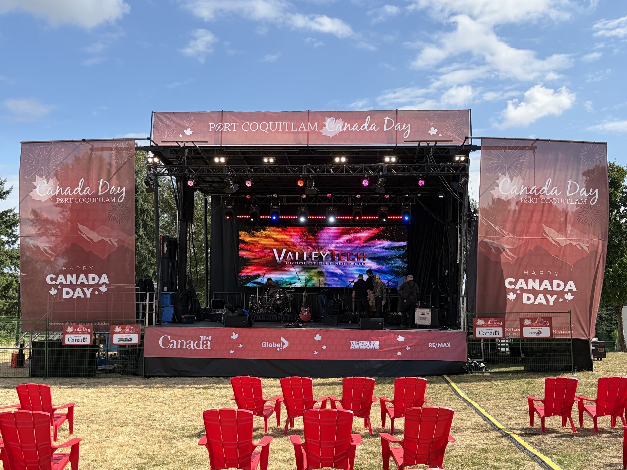 Valley Tech mobile concert stage, LED video wall and PA set up for Port Coquitlam Canada Day, with crew preparing the stage